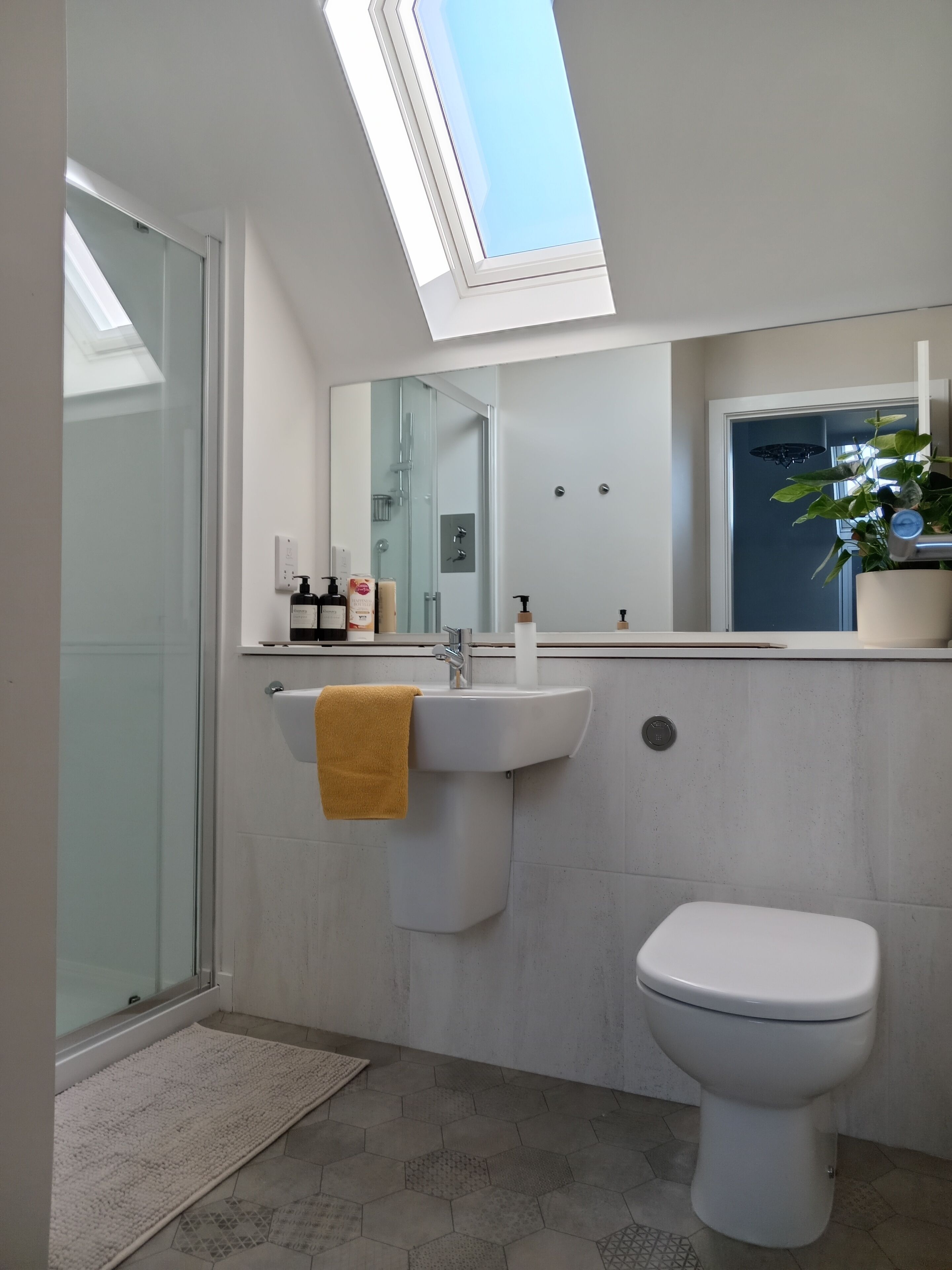 Shower, eco-friendly toiletries, hair dryer, towels
