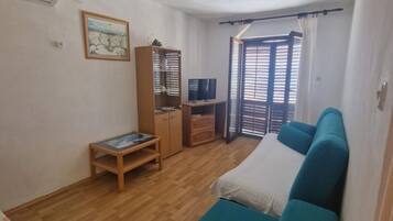 Apartment (One Bedroom Apartment with Balcony an) | Living room | 32-inch flat-screen TV with satellite channels