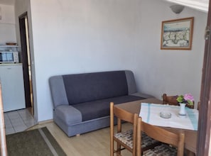 Apartment (Two Bedroom Apartment with Terrace an) | Living room | 32-inch flat-screen TV with satellite channels - Lora Apartments Gradac (Gradac)
