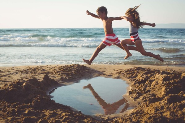 On the beach, windsurfing, kayaking, motor boating