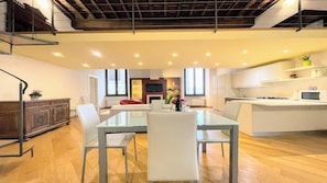 A modern kitchen with white cabinets, a microwave, and a stove. - 6 Guests apt With Terrace in Pedestrian Historic Centre of Spoleto (Spoleto)