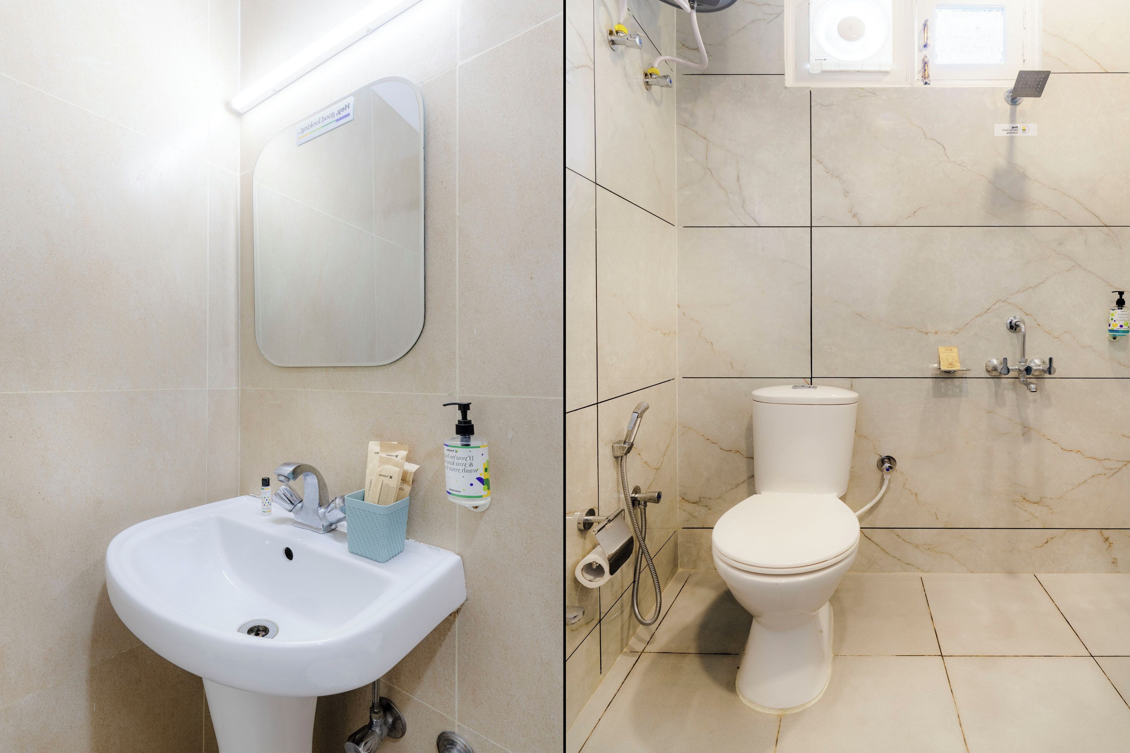 Un baño con lavamanos, espejo, inodoro y ducha.