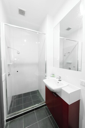 Shower, hair dryer, towels, soap - Melbourne Studio Apartments Hotel @ 138 Elgin Carlton (Carlton)