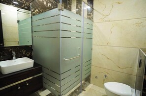 Shower, free toiletries, slippers, soap