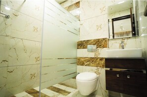 Shower, free toiletries, slippers, soap