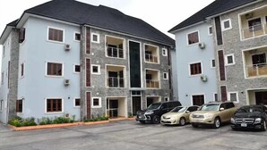 A multi-story residential building with a parking area in front. - Sterling Lakeview Apartment  (Port Harcourt)