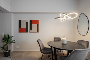 Superior Apartment, Courtyard View | Living area | 50-inch TV with cable channels - Aminandrou Boutique Apartments, Walk To Acropolis (Athens)