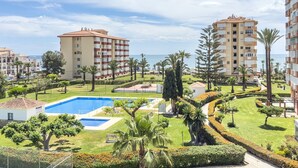 A resort with multiple buildings, a swimming pool, and well-maintained gardens. - Apartment 'Sol and Sea A121' with Sea View, Wi-Fi and Air Conditioning (El Morche)