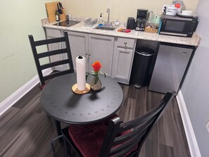 Fridge, coffee/tea maker, toaster, cookware/dishes/utensils