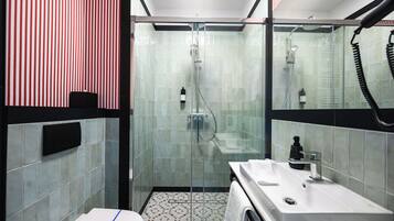 Classic Suite | Bathroom | Hair dryer, slippers, towels, soap