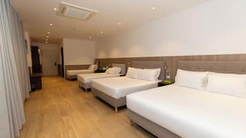 Basic Quadruple Room | In-room safe, desk, laptop workspace, blackout curtains