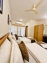 Deluxe Twin Room, City View | Premium bedding, desk, laptop workspace, rollaway beds