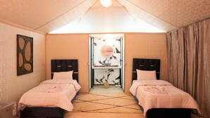 A bedroom with two beds, a ceiling light, a mirror, and a door. - Agafay Tenere Luxury Camp (Agafay)