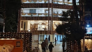 A multi-story building with a sign reading "The Daffodils." - Hotel Daffodils Inn (Dehradun)