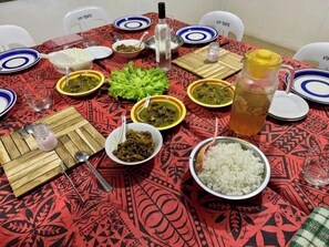 A dining table with various dishes, including rice, vegetables, and meat, set on a patterned tablecloth. - Room-outback Retreathotel, Ba Fiji (Ba)