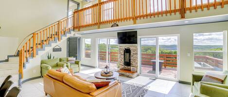 House (3 Bedrooms) | Living area | TV, fireplace, video game console, books