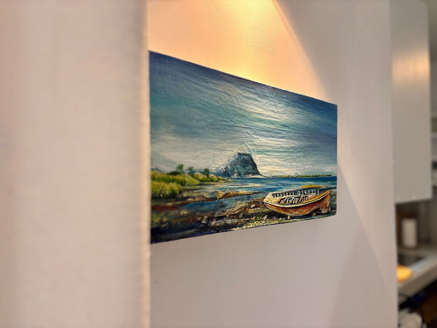 A painting of a coastal scene with a boat and a mountain.