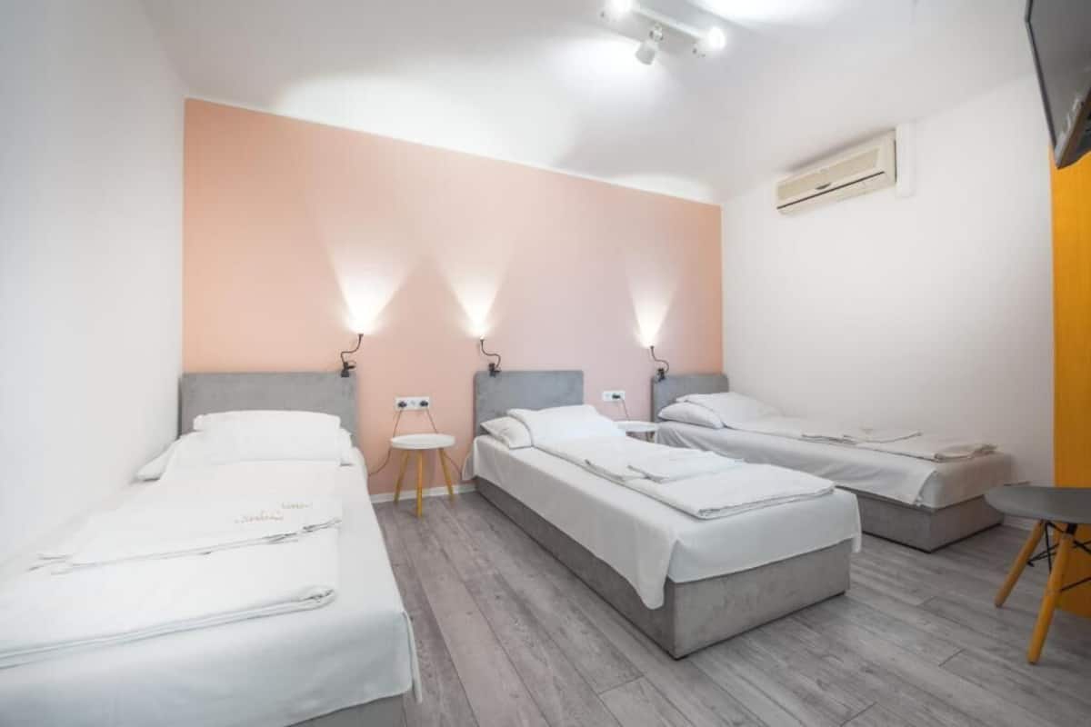 Triple Room | Minibar, in-room safe, desk, laptop workspace