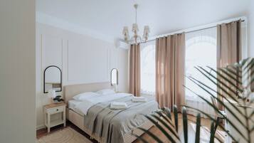 1 bedroom, desk, iron/ironing board, travel crib