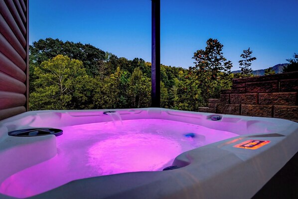A hot tub with a view of a forest and mountains. - More than Swimming in the Smokies (Seymour)
