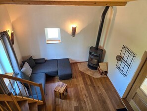 Ferienhaus, Balkon, Gartenblick | Wohnbereich