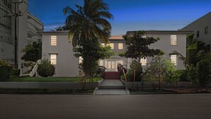 A modern two-story building with a symmetrical facade, large windows, and a central entrance with steps. - Pet-friendly Brickell Stay Near Beach & City (Miami)
