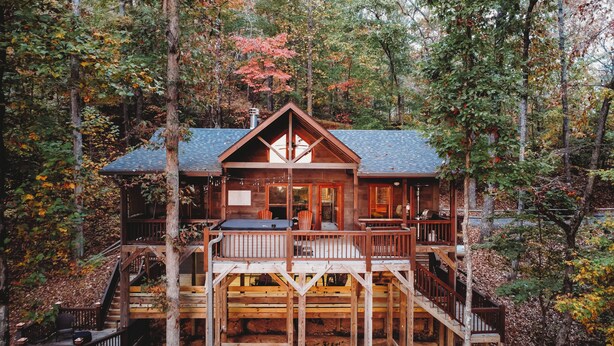 A cabin with a deck, a fireplace, and a large window. - Amazing mountain view!5-star cabin,Modern,Minutes to BR&EJ,Hot tub,Games (Blue Ridge)
