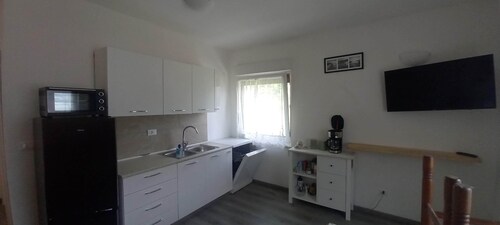 Surrounded by nature, cozy apartment with private garden and grill area
