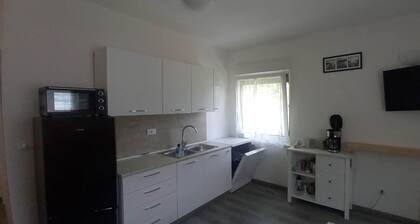 Surrounded by nature, cozy apartment with private garden and grill area