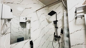 Shower, hair dryer, towels, soap