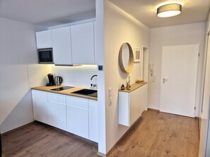 Fridge, microwave, stovetop, coffee/tea maker