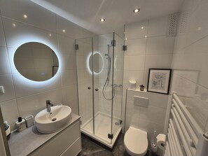 Shower, hair dryer, towels, soap