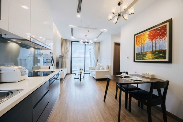 Apartment, 1 Bedroom, Balcony, City View | Living area | Flat-screen TV