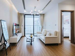 Apartment, 1 Bedroom, Balcony, City View | Living area | Flat-screen TV