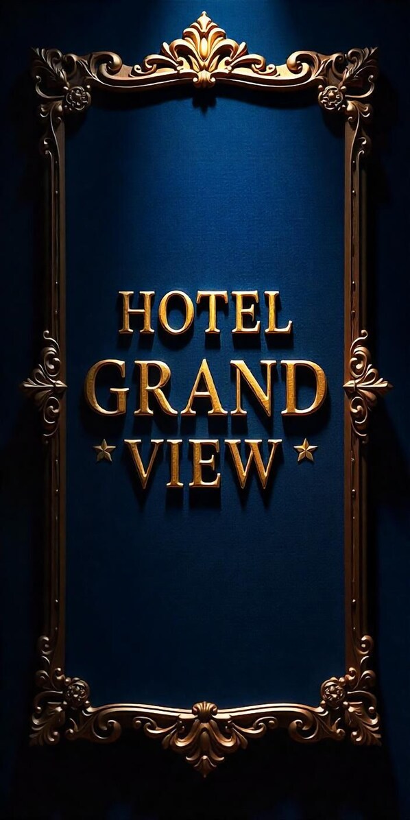 A sign with the text "HOTEL GRAND VIEW" in gold letters, framed by an ornate gold border. - Hotel Grandview And coliving (Hyderabad)