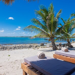 On the beach, sun loungers, beach towels