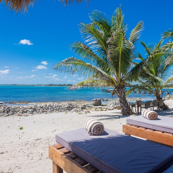 On the beach, sun-loungers, beach towels
