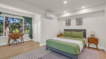 1 bedroom, desk, iron/ironing board, travel crib
