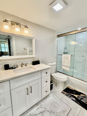 Shower, hair dryer, towels, soap