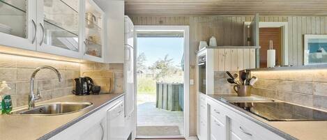 Fridge, stovetop, dishwasher, coffee/tea maker