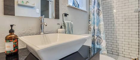 Shower, hair dryer, towels, soap