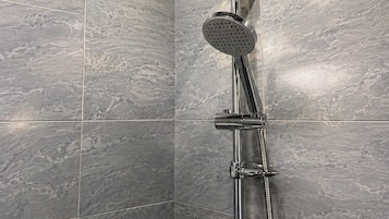 Separate bathtub and shower, free toiletries, towels, soap
