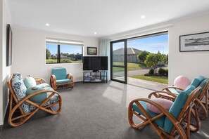 Relax in this serene living space with an outdoor area and comfortable seating.