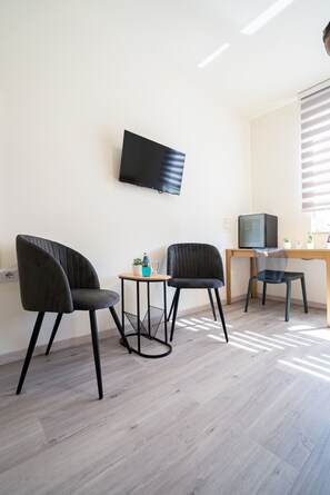 패밀리 트리플룸, 앙스위트, 시내 전망 | 고급 침구, 메모리폼 침대, 미니바, 노트북 작업 공간