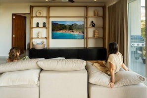 Deluxe Apartment, Beach View | Living area | 65-inch Smart TV with digital channels - Pacifica by Pardela (Bucerías)