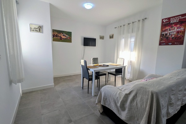 Comfort Apartment, Courtyard View | Living area | 32-inch Smart TV with digital channels, books, streaming services