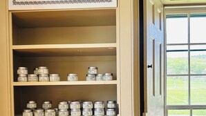 A shelf with various herbs and teas, including basil, oregano, and rosemary. - Enfield Shaker Museum (Enfield)