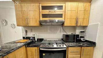 Coffee/tea maker, blender, dining tables, kitchen islands