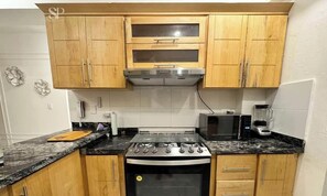 Coffee/tea maker, blender, dining tables, kitchen islands