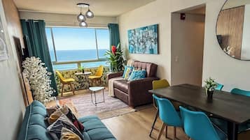 Comfort Apartment, 3 Bedrooms, Balcony, Beach View | Living area | Flat-screen TV